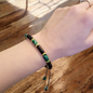 Minimalist bracelet handcrafted with mixed green and black jasper beads, featuring a simple and earthy design perfect for layering or everyday wear.
