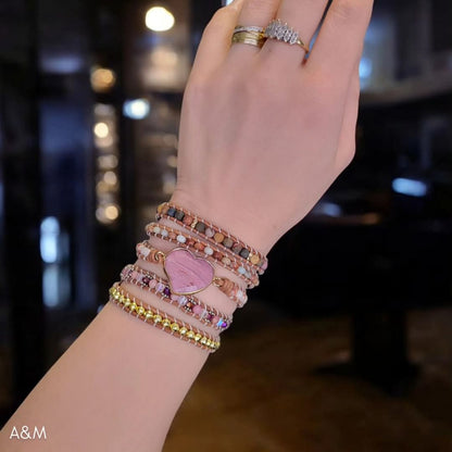 Five-wrap bohemian bracelet made with Picasso Jasper beads and a rhodonite heart charm, handcrafted in earthy tones for a natural, spiritual style.