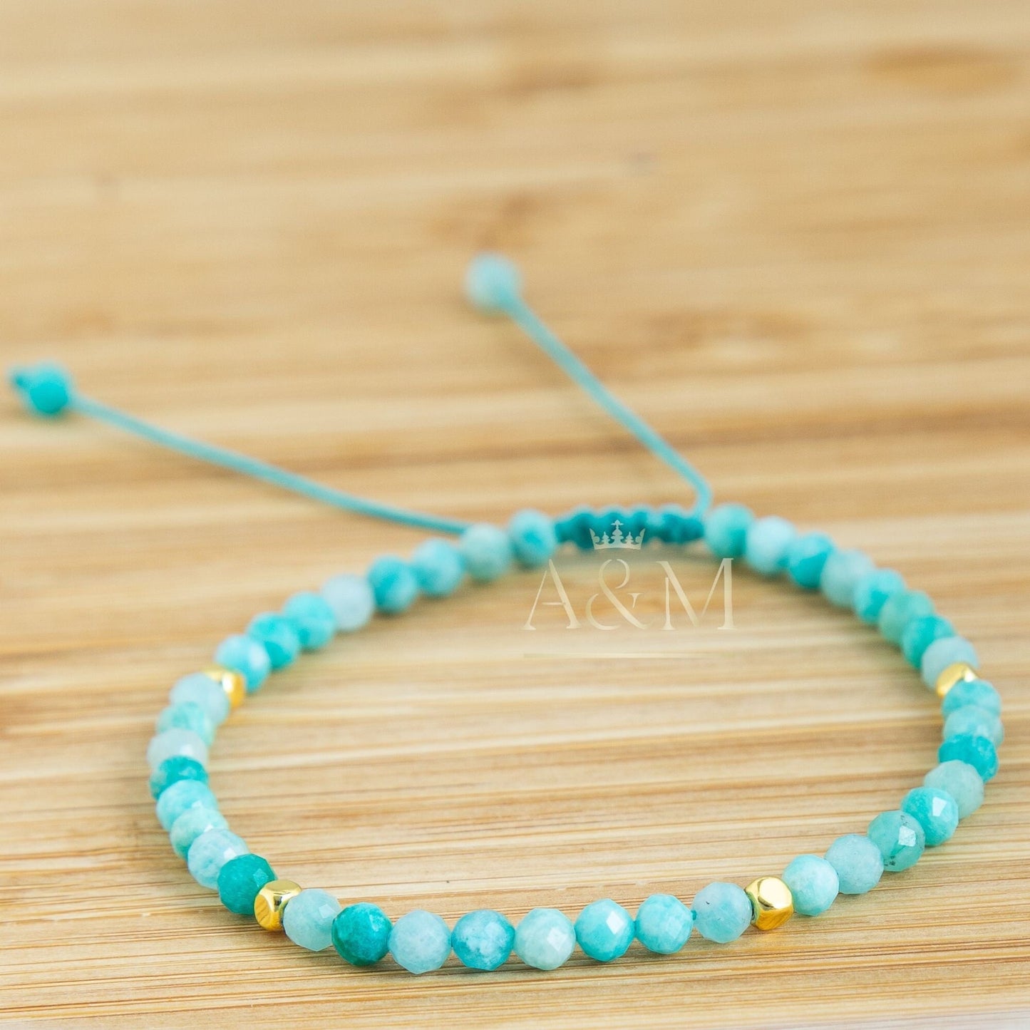 Handmade minimalist bracelet featuring 4mm faceted amazonite beads, known for their soothing blue-green color. Adjustable design, perfect for adding a calming, nature-inspired touch to your jewelry collection or as a thoughtful gift.