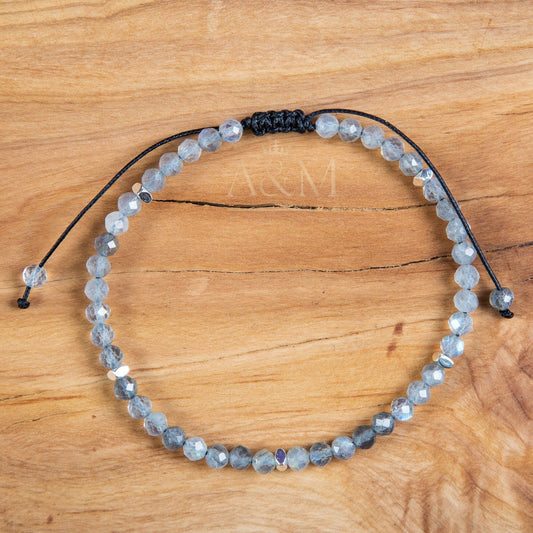 Handmade minimalist bracelet featuring 4mm faceted labradorite beads, known for their stunning play of color. Adjustable design, perfect for adding a mystical, iridescent touch to your jewelry collection or as a meaningful gift.